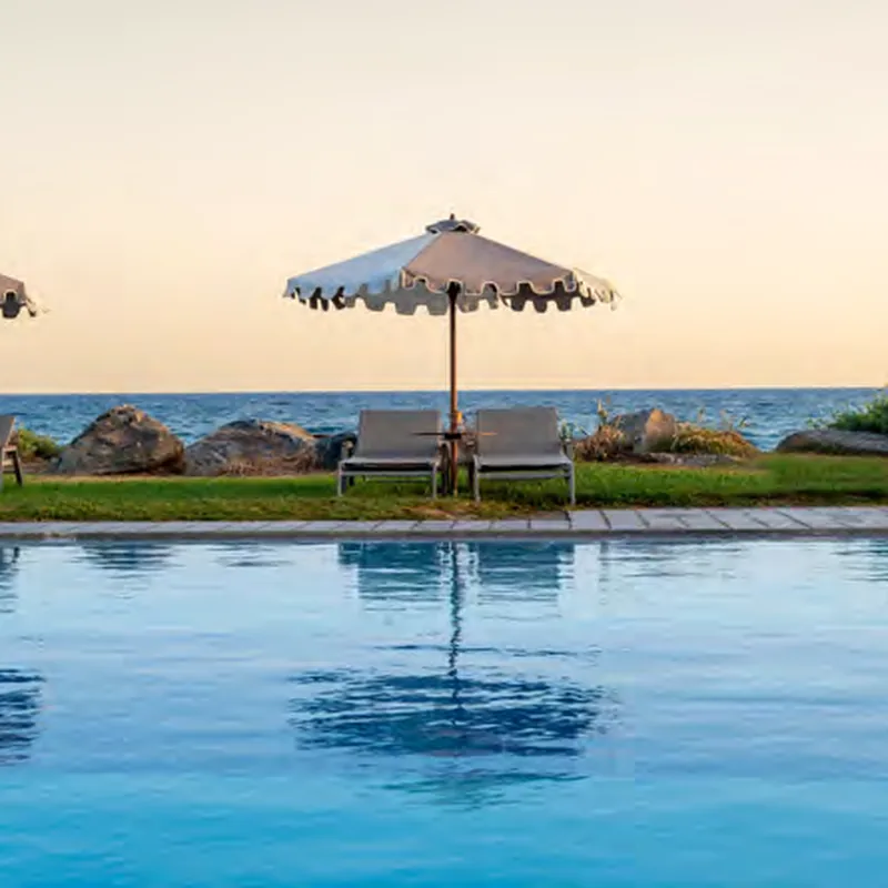 Infinity pool at sunset at Aquila Rithymna Beach