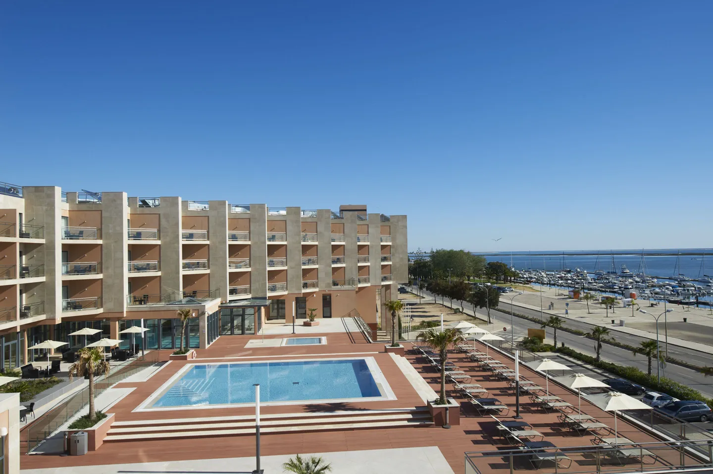Real Marina Hotel & Spa and its outdoor pool